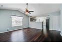 Open-concept living room features hardwood floors and a ceiling fan, offering a welcoming atmosphere at 507 Tayrn Dr, Charleston, SC 29492
