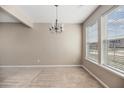 Bright and spacious living room area featuring neutral paint, carpet, and large windows at 529 Pleasant Side Dr, Moncks Corner, SC 29461