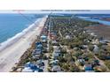 Beautiful aerial view of a beach house close to Folly Beach Pier and local restaurants at 716 E Arctic Ave, Folly Beach, SC 29439