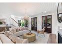 Cozy living room with hardwood floors, comfortable seating, fireplace, and bright natural light at 722 Minton Rd, Charleston, SC 29412
