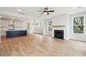 Open concept living space with hardwood floors, granite countertops, and black island at 722 Minton Rd, Charleston, SC 29412