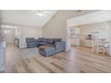 Spacious living room featuring vaulted ceilings and an open layout to the kitchen at 8405 Wylie Dr, North Charleston, SC 29406