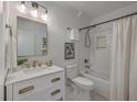 Bright bathroom with white subway tile, a marble countertop, and gold fixtures at 10 Humphrey Ct, Charleston, SC 29403
