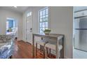 Cozy breakfast nook featuring a small table, two stools, and abundant natural light at 10 Humphrey Ct, Charleston, SC 29403