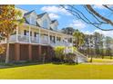Charming two-story home with a welcoming front porch and well-maintained landscaping at 1008 Hoodtown Rd, Bonneau, SC 29431