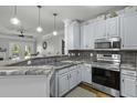 Beautiful kitchen featuring granite countertops, stainless steel appliances and ample cabinet space at 1025 Riverland Woods Pl # 609, Charleston, SC 29412