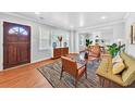 Bright living room featuring hardwood floors, stylish furniture and ample natural light at 1077 Harbor View Rd, Charleston, SC 29412