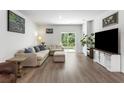 Comfortable living room with a sofa, loveseat, and sliding glass doors to the backyard at 111 Vistawood Dr, Charleston, SC 29414