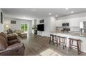 Bright open-concept living room and kitchen with hardwood floors and modern finishes at 111 Vistawood Dr, Charleston, SC 29414