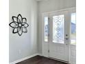 Foyer with decorative door, and hardwood floors at 116 Rouen Ln, Summerville, SC 29486