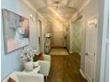 Inviting hallway with hardwood floors, decorative lighting, and stylish decor, creating a warm and welcoming atmosphere at 150 Haverhill St, Summerville, SC 29486