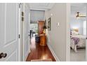Inviting hallway with hardwood floors and views into the living room and main bedroom at 1617 Southwick Dr, Johns Island, SC 29455