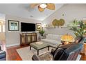Comfortable living room with plush seating, a ceiling fan, and large windows for natural light at 1617 Southwick Dr, Johns Island, SC 29455