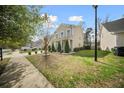 Pleasant view of the two-story home showcasing its landscaped yard and proximity to neighboring houses at 166 Pavilion St, Summerville, SC 29483