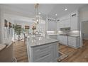 Bright and airy kitchen with large island, marble countertops, stainless steel appliances, and eat-in area at 2041 Ashburton Way, Mount Pleasant, SC 29466