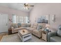 Inviting living room featuring vaulted ceiling, comfortable seating and an abundance of natural light at 205 Yellow Hawthorn Cir, Summerville, SC 29483