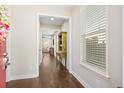 Inviting hallway with hardwood floors and a glimpse into the living area at 207 Billinger St, Summerville, SC 29486