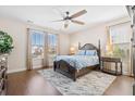 Comfortable main bedroom with a ceiling fan, hardwood floors, and ample natural light at 207 Billinger St, Summerville, SC 29486
