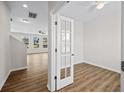 Bright office space with wood floors, a ceiling fan, a glass door, and large windows that provide lots of natural light at 2150 Pimlico Dr, Ridgeville, SC 29472