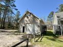 Detached garage with ample space for parking and storage in a wooded, natural environment at 2164 Highway 78, Dorchester, SC 29437