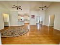 Spacious living room featuring hardwood floors and views into the kitchen at 2164 Highway 78, Dorchester, SC 29437
