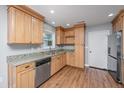 Well-lit kitchen with light wood cabinets, granite countertops, and stainless steel appliances at 2306 Chairmaker Ct, Charleston, SC 29414