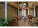 Charming courtyard with outdoor seating and lush landscaping beneath a multi-story deck at 2522 Egret Crest Ln, Charleston, SC 29414