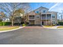 Well-maintained condo exterior with driveways and lush landscaping at 2522 Egret Crest Ln, Charleston, SC 29414
