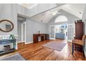 Bright living room with hardwood floors, vaulted ceiling, and French doors leading to the back at 2707 Waterpointe Cir, Mount Pleasant, SC 29466
