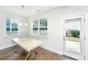 Bright dining room featuring a table, with ample natural light from the surrounding windows at 2917 Swamp Sparrow Cir, Johns Island, SC 29455