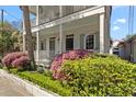 Inviting two-story home with a porch, framed by vibrant landscaping, showcasing curb appeal and a welcoming facade at 382 Race St # A, Charleston, SC 29403