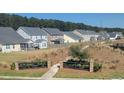 Neighborhood backyards with fences, lush grass, and mature trees, offering privacy and space at 587 Crossland Dr, Moncks Corner, SC 29461