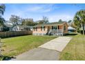 Inviting one-story house with a well-manicured lawn and a convenient driveway at 679 Kent St, Mount Pleasant, SC 29464