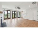 Bright living room featuring a fireplace, hardwood floors, and patio doors offering views of the outdoors at 740 Minton Rd, Charleston, SC 29412