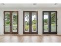 View of the backyard through a set of french doors at 750 Minton Rd, Charleston, SC 29412