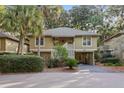 Charming two-story cottage-style home with lush landscaping and covered parking at 1153 Summerwind Ln, Seabrook Island, SC 29455