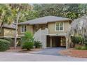 Inviting two-story cottage with elevated design and ground-level parking at 1153 Summerwind Ln, Seabrook Island, SC 29455