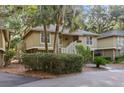 Quaint two-story cottage with elevated design and lush landscaping at 1153 Summerwind Ln, Seabrook Island, SC 29455