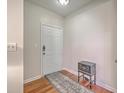 Clean entryway features hardwood floors, a white door, and decorative chest at 1822 Chatelain Way, Mount Pleasant, SC 29464