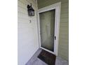 Front door of condo unit with a lantern and unit number on the exterior wall at 2326 Treescape Dr # 2, Charleston, SC 29414