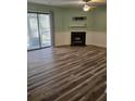 Spacious living room featuring wood flooring, fireplace, tv hookups and sliding doors at 2326 Treescape Dr # 2, Charleston, SC 29414