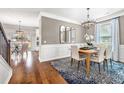 Charming dining room with natural lighting, a stylish chandelier, and an elegant table set for a cozy dining experience at 2800 Lacy St, North Charleston, SC 29406