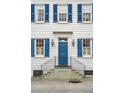 Elegant home entrance with a blue door, classic sidelights, and decorative lanterns at 3 Atlantic St, Charleston, SC 29401