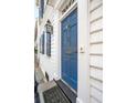 Charming blue front door featuring stylish hardware, sidelight and beautiful trim at 3 Atlantic St, Charleston, SC 29401