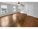 Living room featuring beautiful wood floors, natural light and a ceiling fan at 3048 Queensgate Way, Mount Pleasant, SC 29466