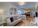Cozy living space seamlessly connected to a modern kitchen with stainless steel appliances at 338 King St # B, Charleston, SC 29401