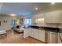 Inviting living space featuring a kitchen, sofa, and ample natural light at 338 King St # B, Charleston, SC 29401