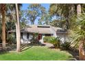 Attractive home featuring mature foliage and landscaping around the property at 3475 Deer Run Rd, Seabrook Island, SC 29455