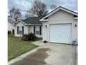 Inviting home featuring a garage, manicured lawn, and a cozy, neighborhood appeal at 429 Stephanie Dr, Goose Creek, SC 29445