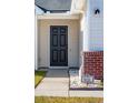 Close-up of the front door with brick accents and visible house number at 5020 Holdsworth Dr, Summerville, SC 29485